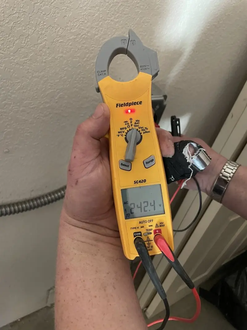Voltage testing with clamp meter during Whole House Surge Protector in Edmond